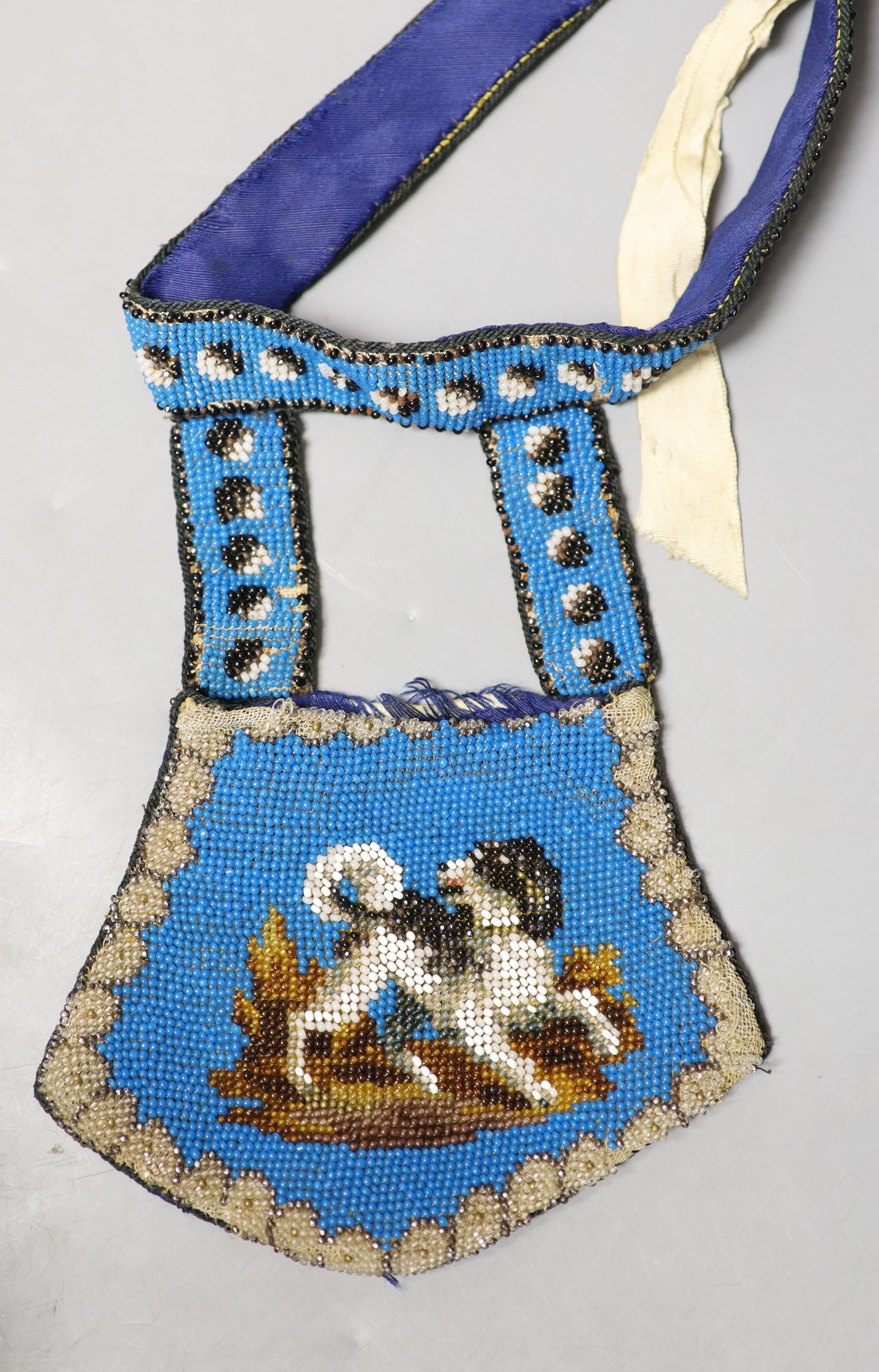 A collection of approximately fifty Victorian and later beadwork, white metal and fabric purses etc.